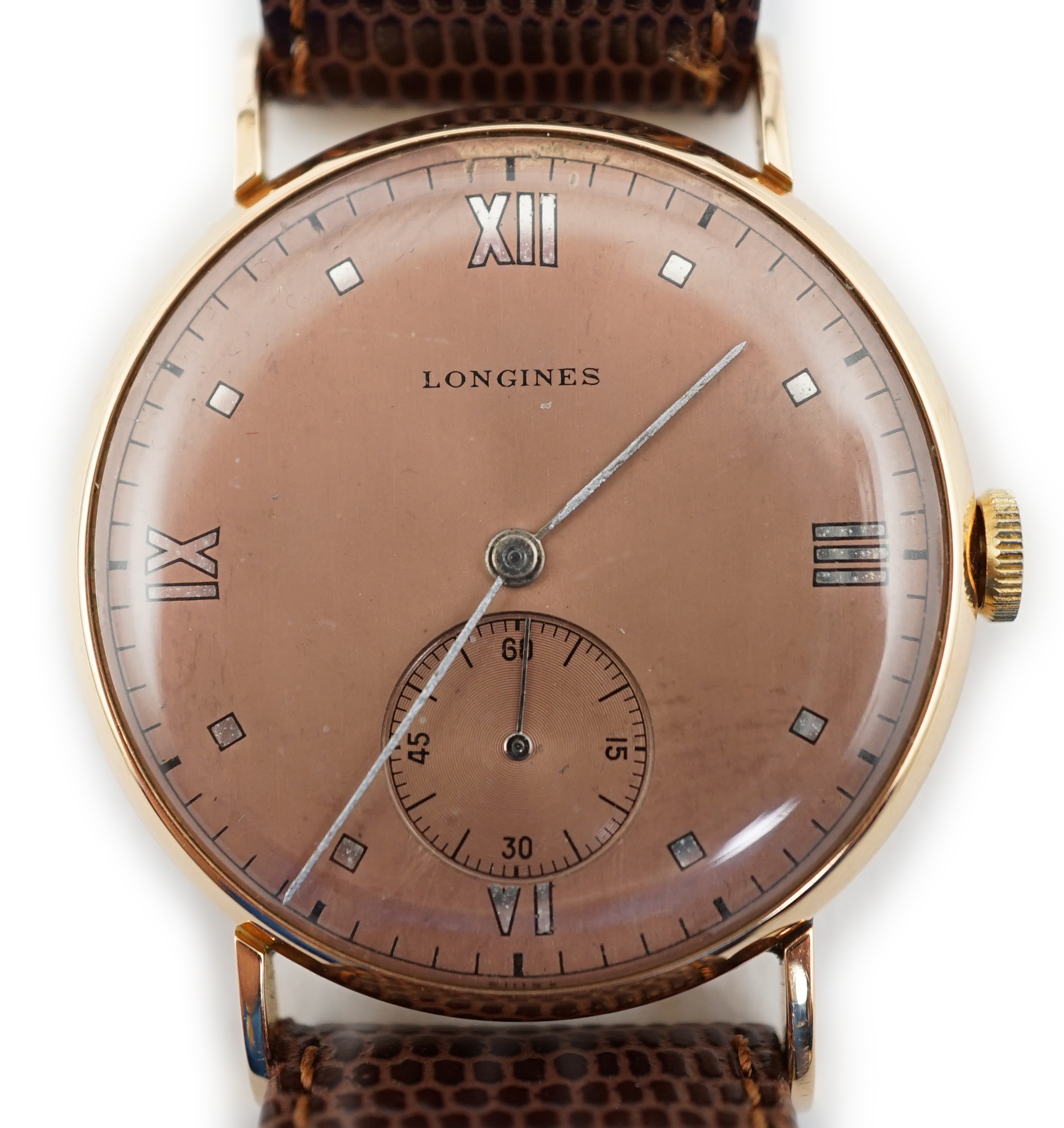 A gentleman's 1950's 18k pink gold Longines manual wind wrist watch